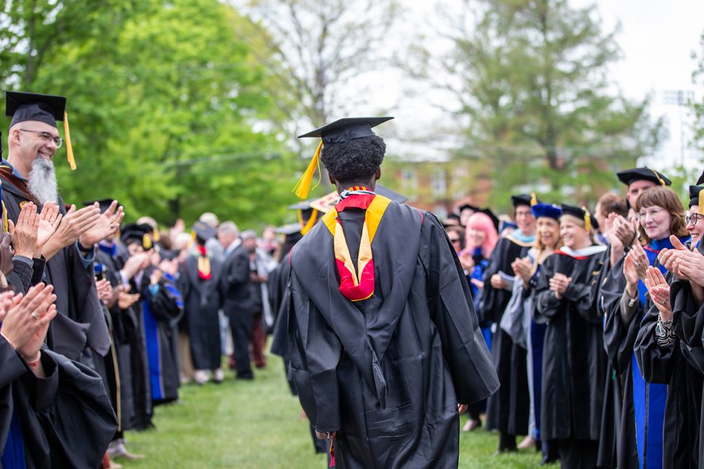Graduating student walking at commencement